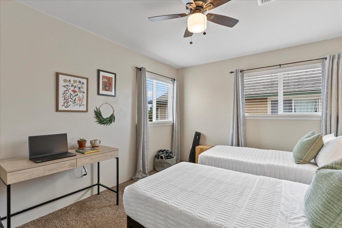 28 Papahi Loop Kahului, HI 96732 - Photo 43 of 50 a bedroom with a bed and a desk