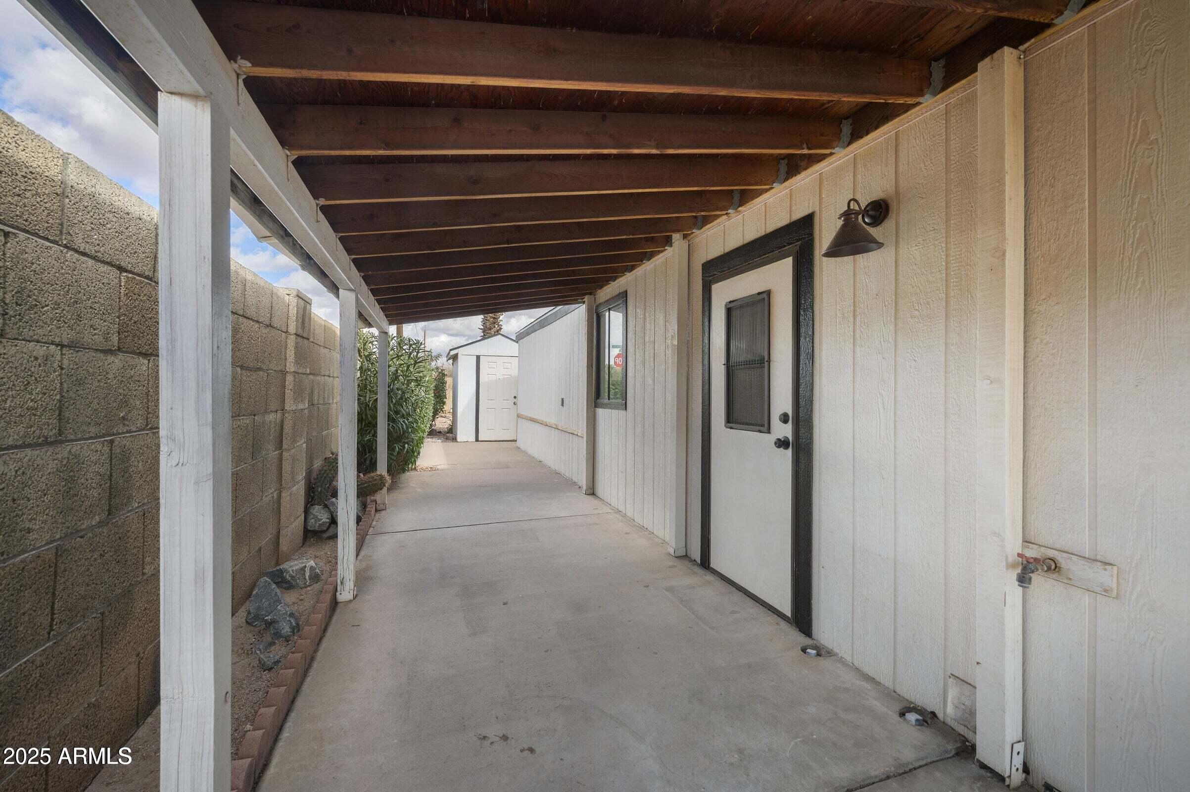 3500 South Tomahawk Road, Unit 126 Apache Junction, AZ 85119 - Photo 12 of 38 a view of hallway with wooden floor