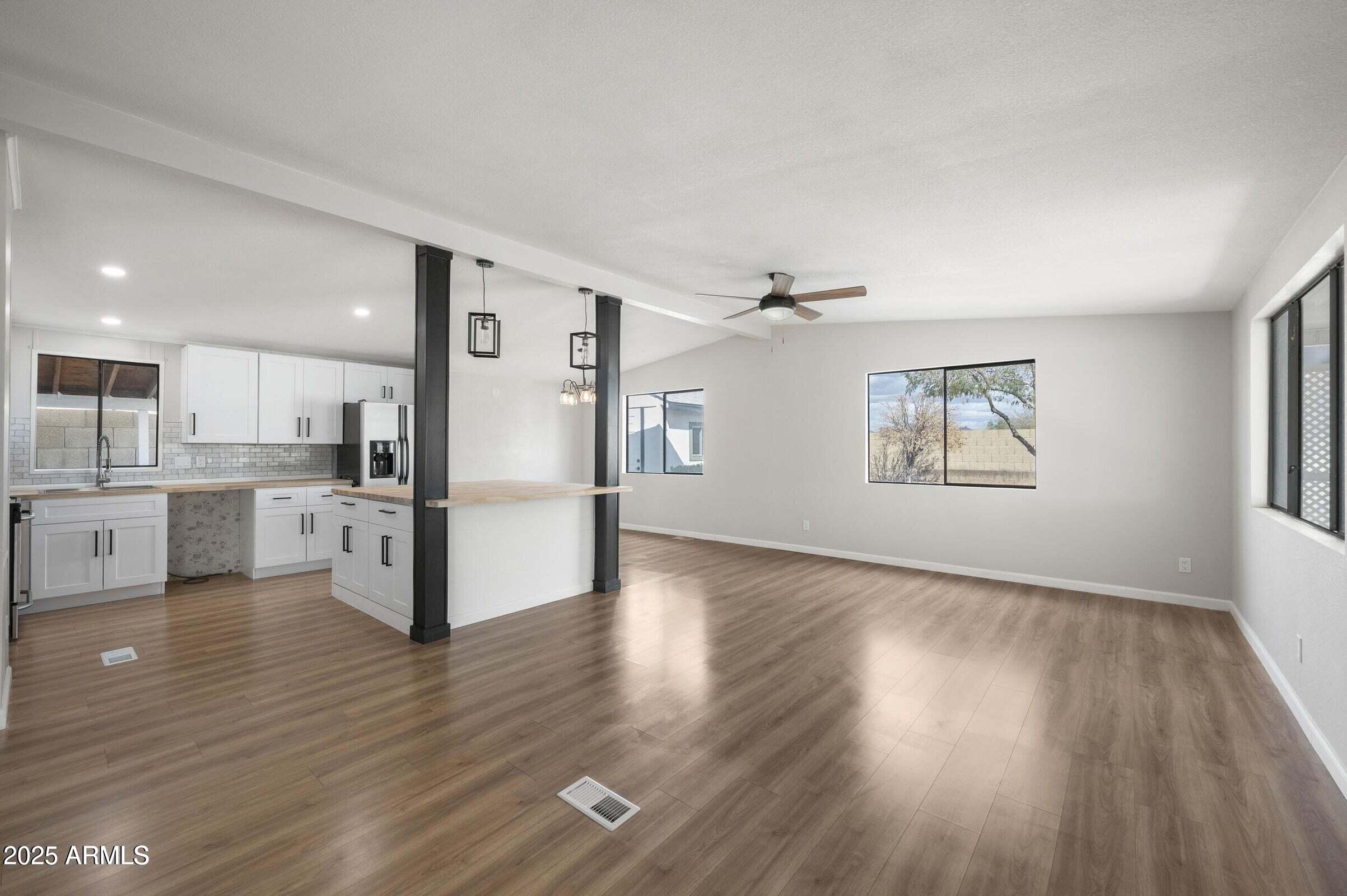 3500 South Tomahawk Road, Unit 126 Apache Junction, AZ 85119 - Photo 13 of 38 a view of kitchen with wooden floor electronic appliances and window