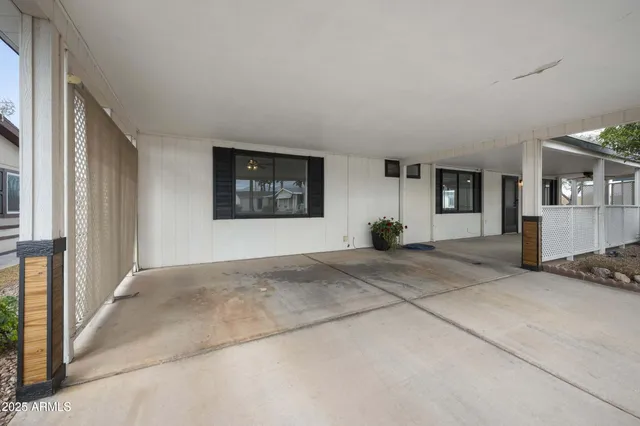 a view of a livingroom with furniture and windows
