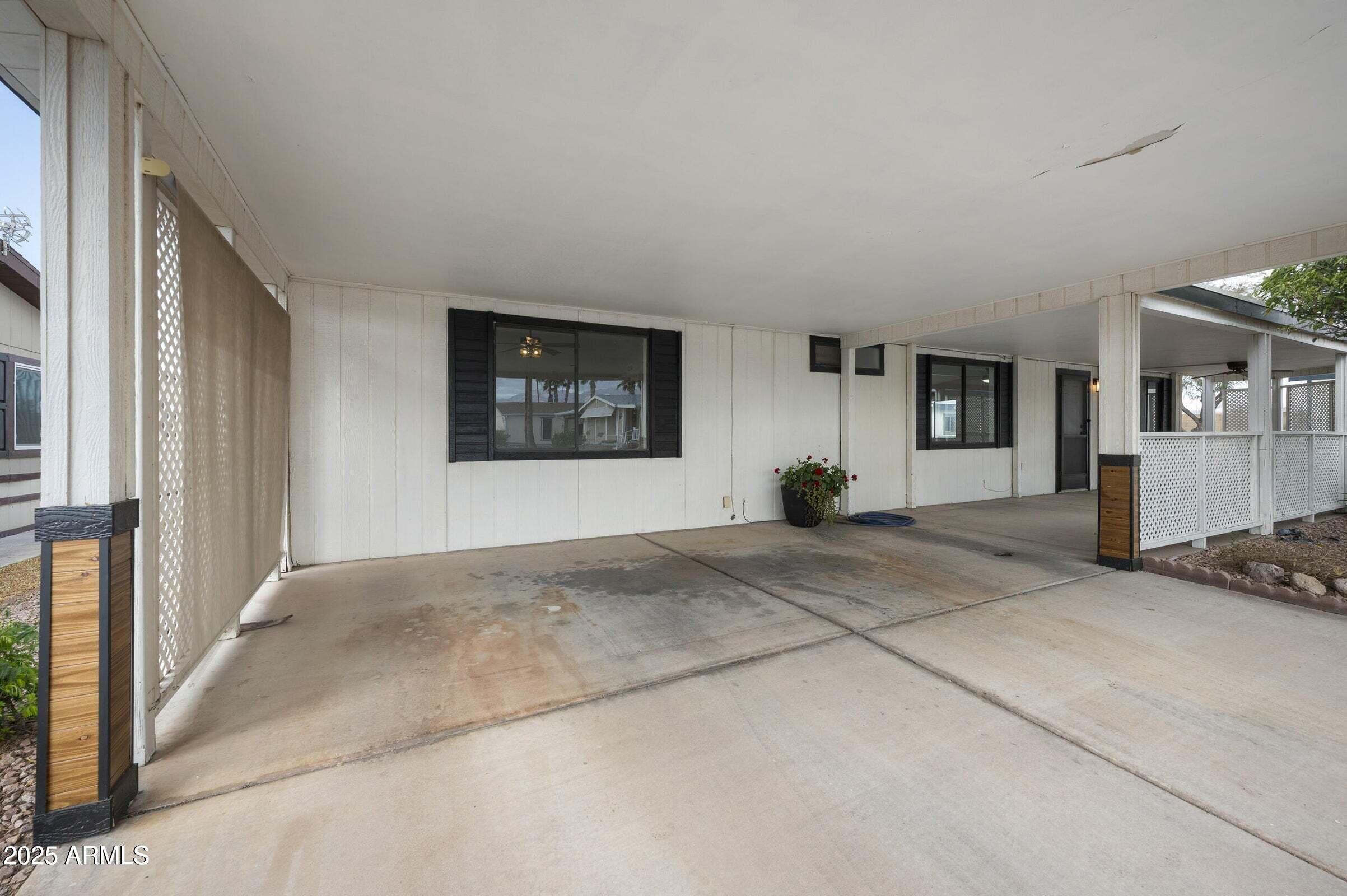 3500 South Tomahawk Road, Unit 126 Apache Junction, AZ 85119 - Photo 26 of 38 a view of a livingroom with furniture and windows