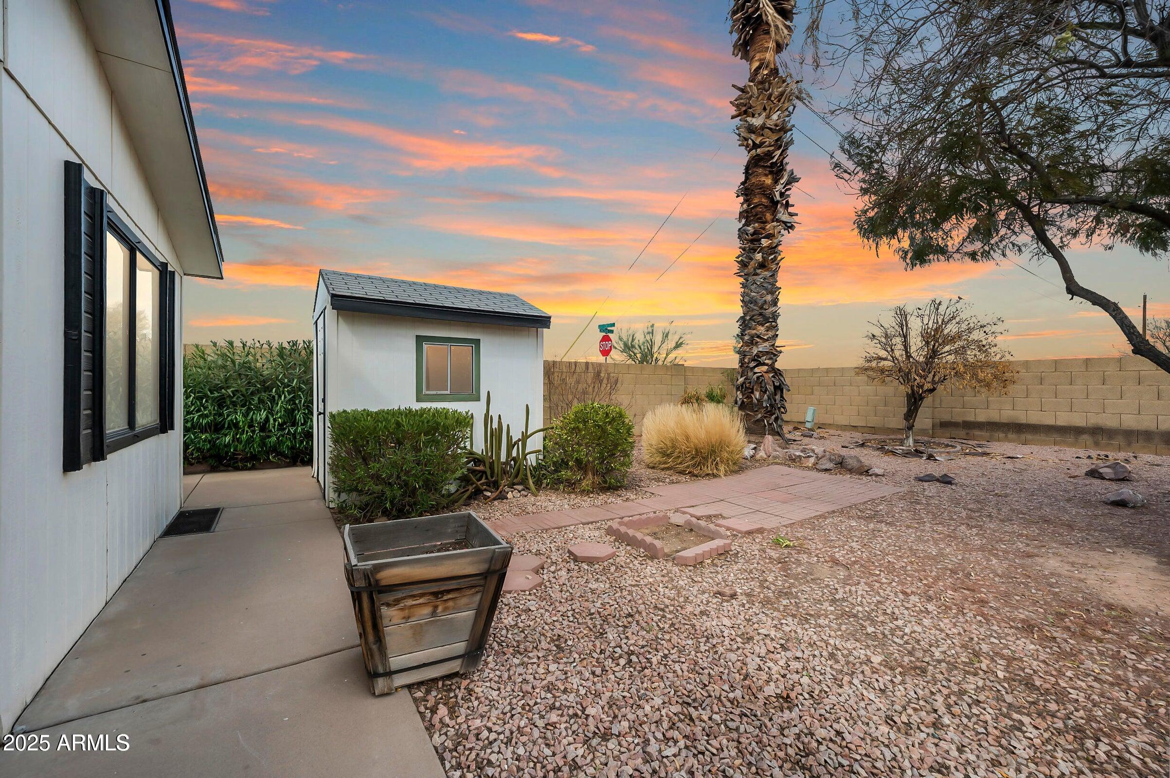 3500 South Tomahawk Road, Unit 126 Apache Junction, AZ 85119 - Photo 29 of 38 a view of a backyard with sitting area