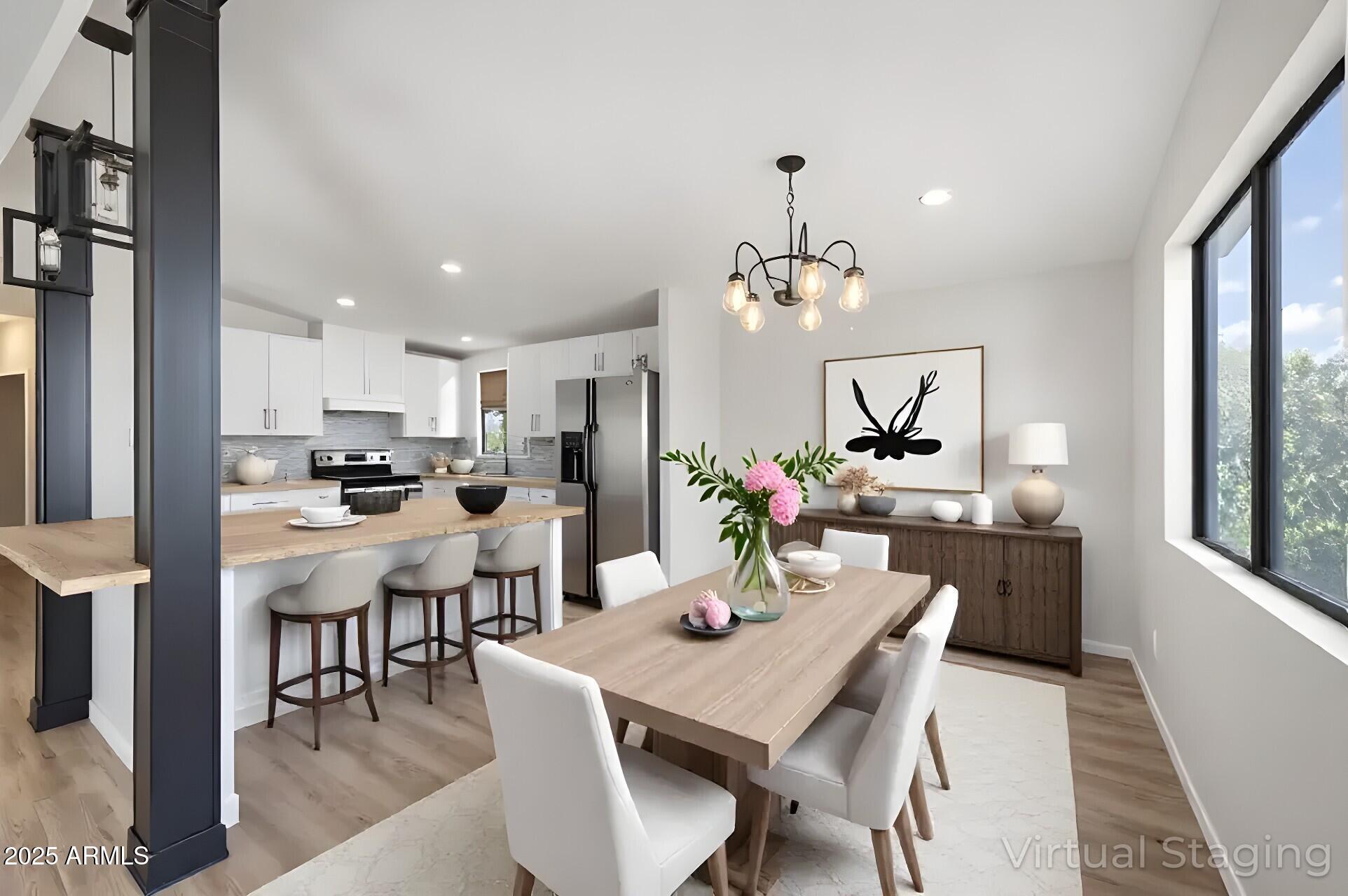 3500 South Tomahawk Road, Unit 126 Apache Junction, AZ 85119 - Photo 4 of 38 a view of a dining room with furniture and wooden floor