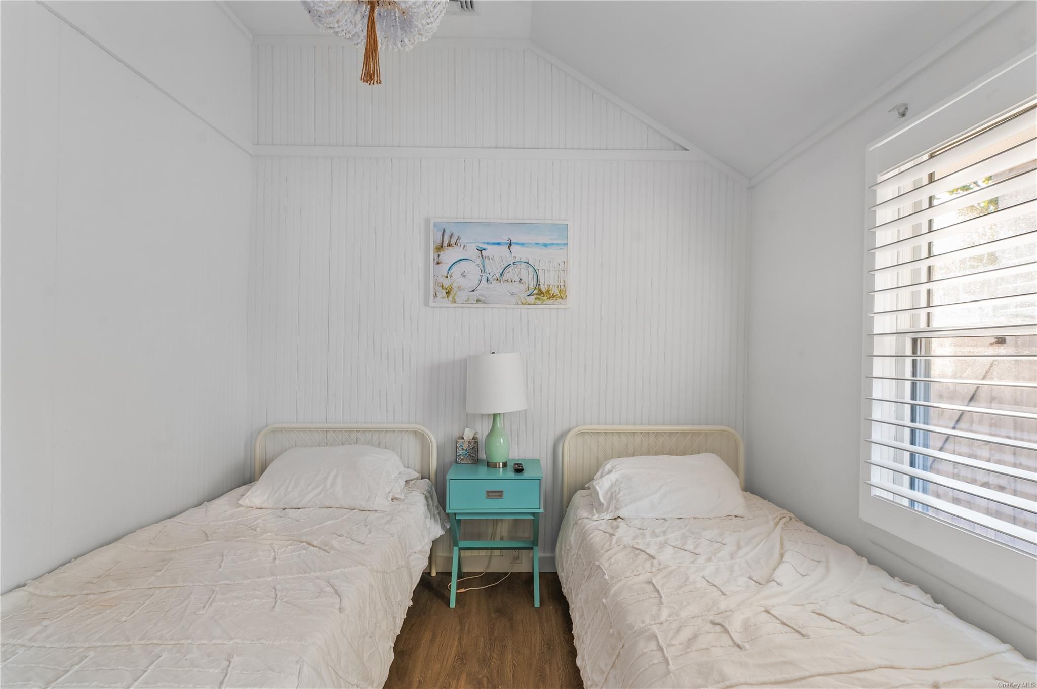 311 Wilmot Road Ocean Beach, NY 11770 - Photo 11 of 12 Bedroom with vaulted ceiling and hardwood / wood-style floors