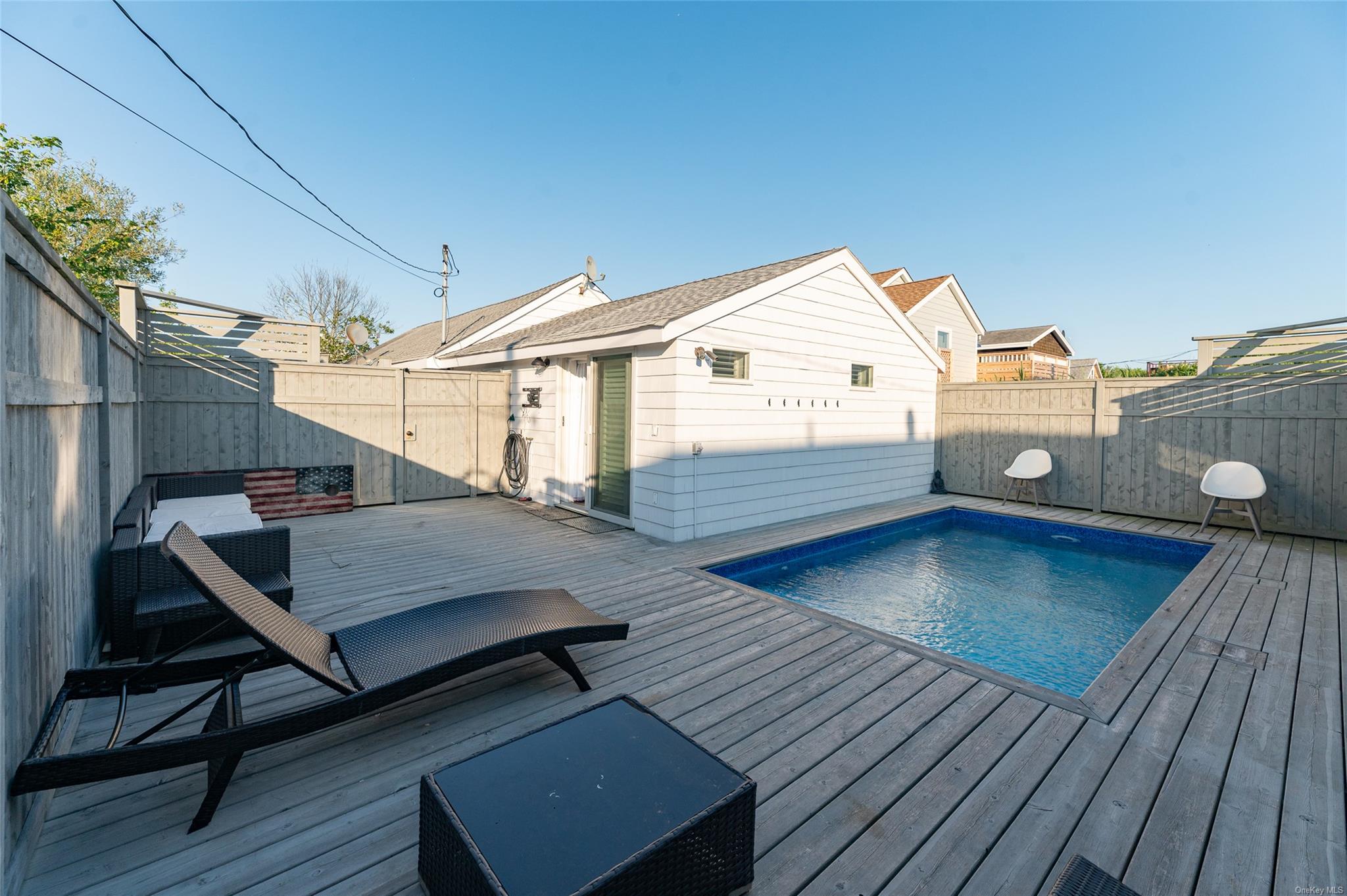 311 Wilmot Road Ocean Beach, NY 11770 - Photo 2 of 12 View of pool featuring a deck