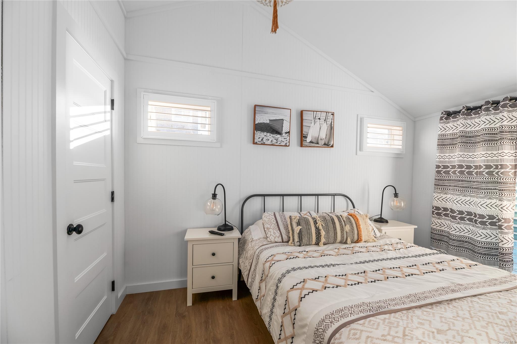 311 Wilmot Road Ocean Beach, NY 11770 - Photo 5 of 12 Bedroom with lofted ceiling and dark wood-type flooring