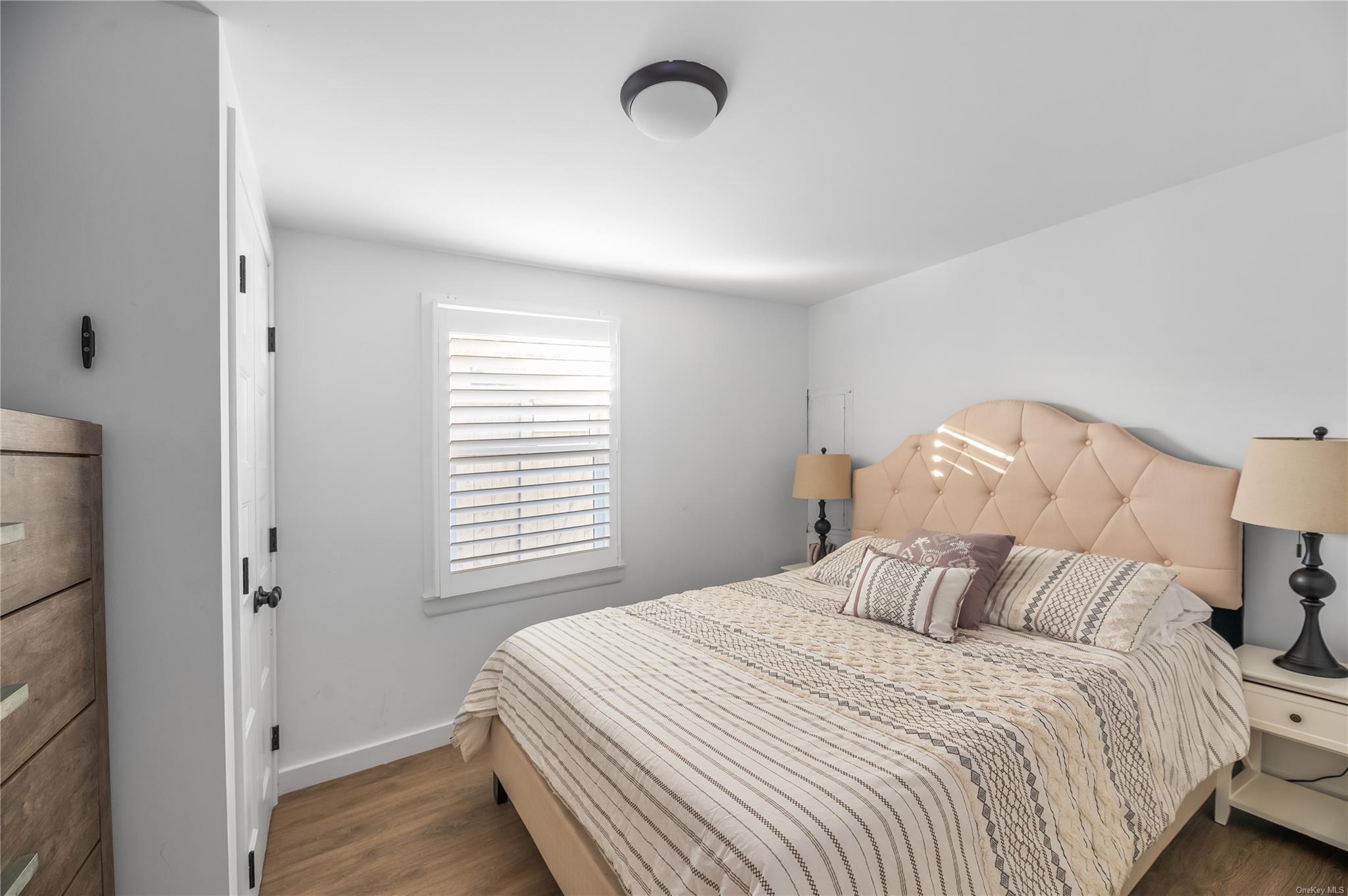 311 Wilmot Road Ocean Beach, NY 11770 - Photo 6 of 12 Bedroom featuring dark hardwood / wood-style floors
