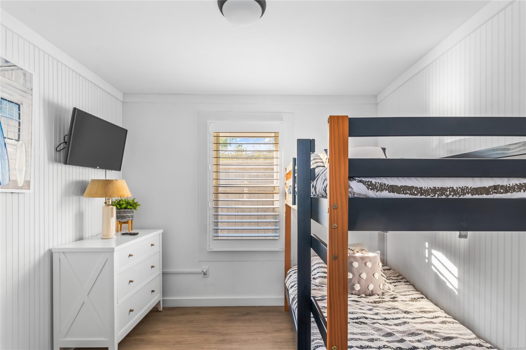 311 Wilmot Road Ocean Beach, NY 11770 - Photo 8 of 12 Bedroom with light wood-type flooring