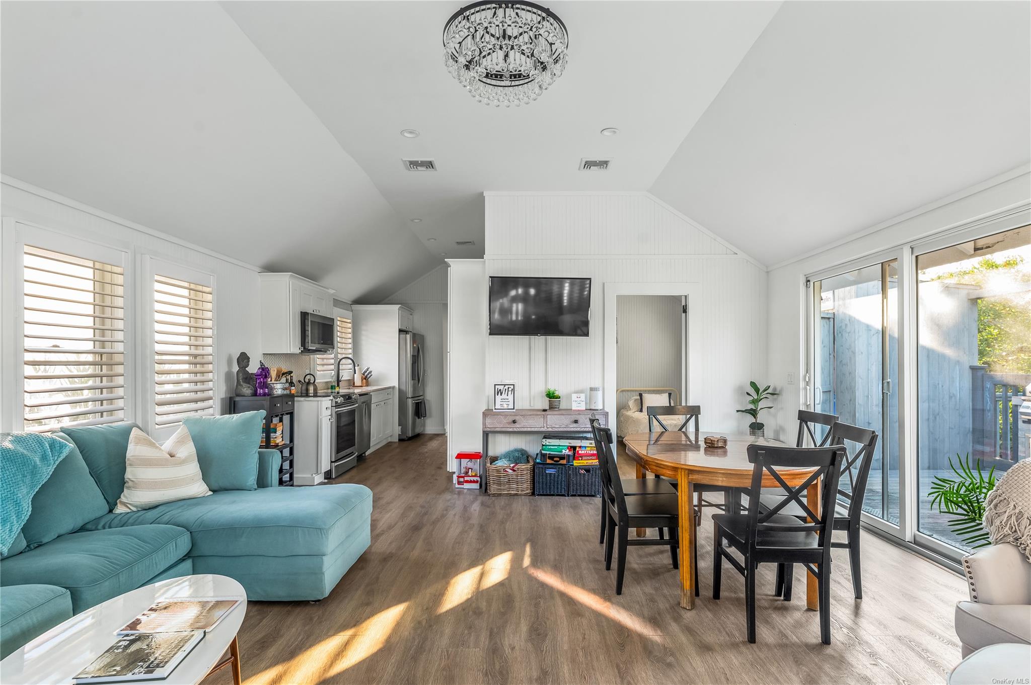 311 Wilmot Road Ocean Beach, NY 11770 - Photo 10 of 12 Living room featuring hardwood / wood-style flooring, lofted ceiling, and sink