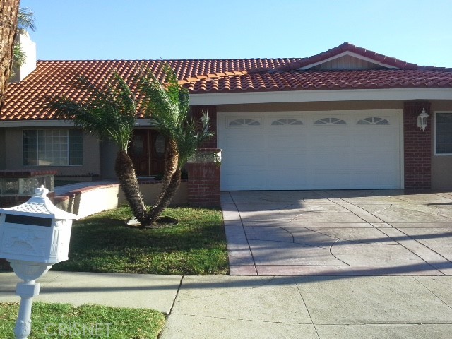 18918 Kinbrace Street Porter Ranch, CA 91326 - Photo 1 of 16 a front view of a house with garden