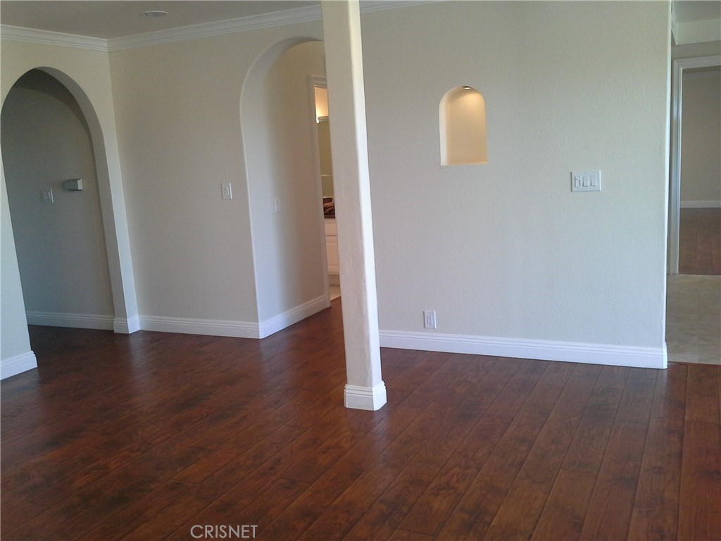 18918 Kinbrace Street Porter Ranch, CA 91326 - Photo 8 of 16 a view of a livingroom with wooden floor and window