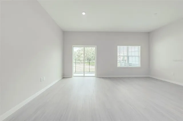a view of a kitchen with a sink and cabinets