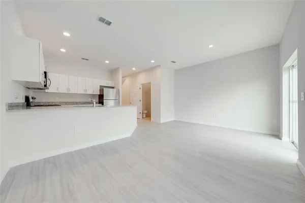 a view of an empty room with a window