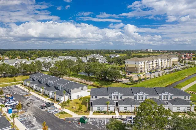 a view of a swimming pool and outdoor seating