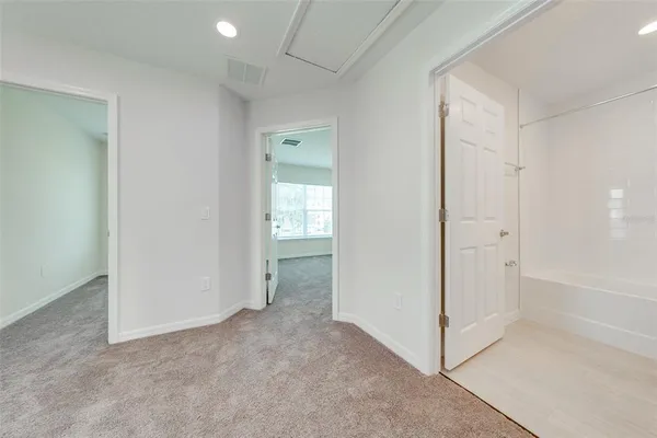 a bathroom with a granite countertop sink a toilet and shower
