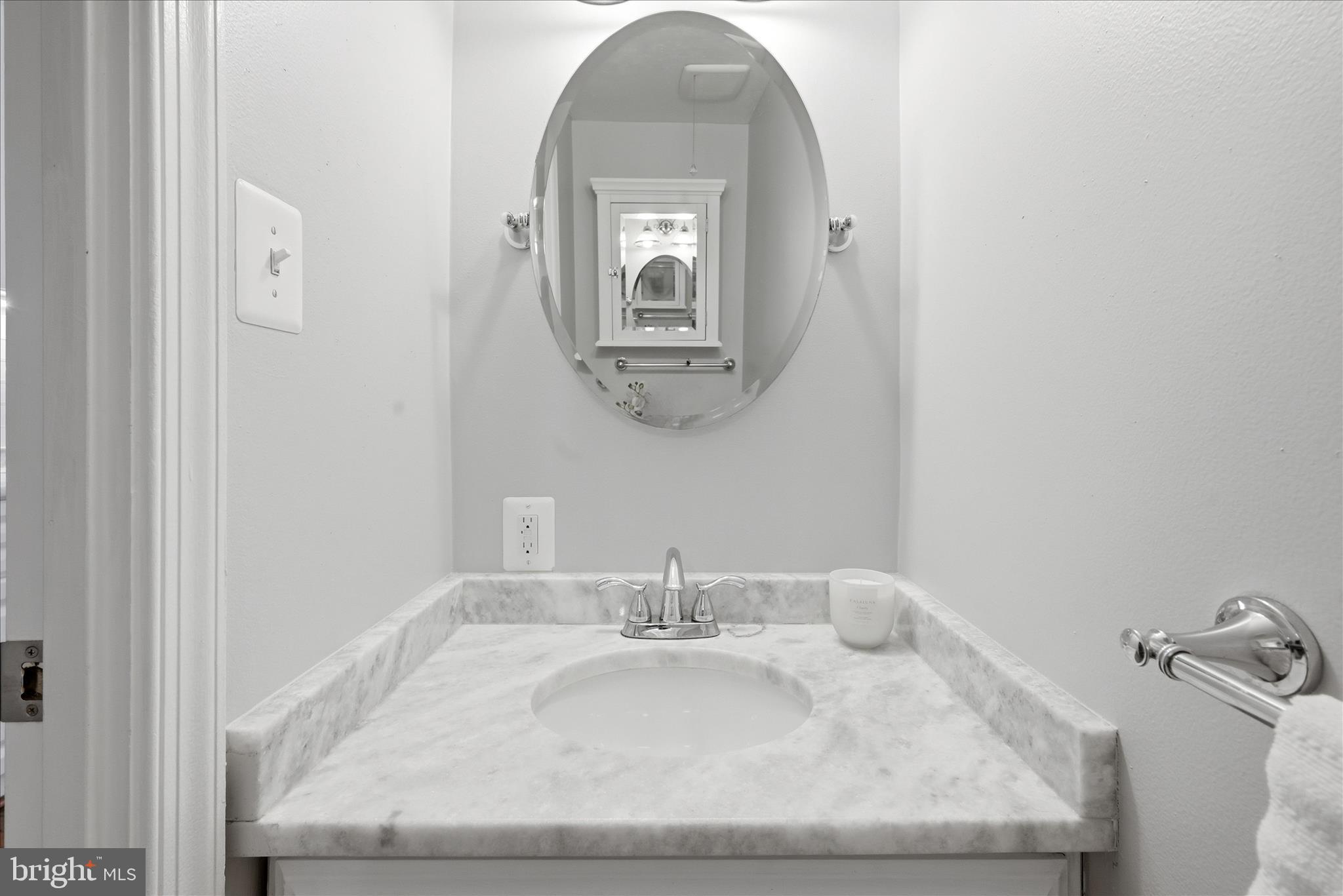 5446 Lighthouse Lane Burke, VA 22015 - Photo 11 of 36 a bathroom with a sink and a mirror