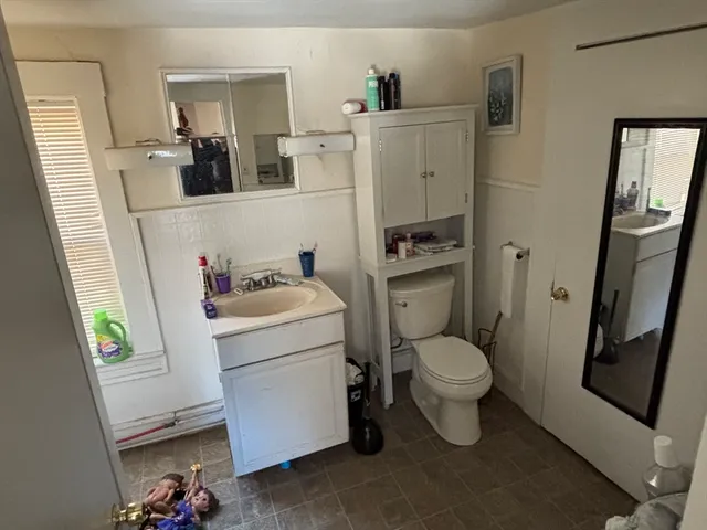 a view of a livingroom with furniture and hardwood floor