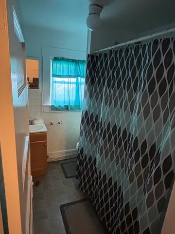 a bedroom with furniture and a wooden floor