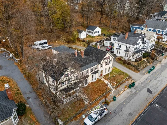 an aerial view of a house with swimming pool