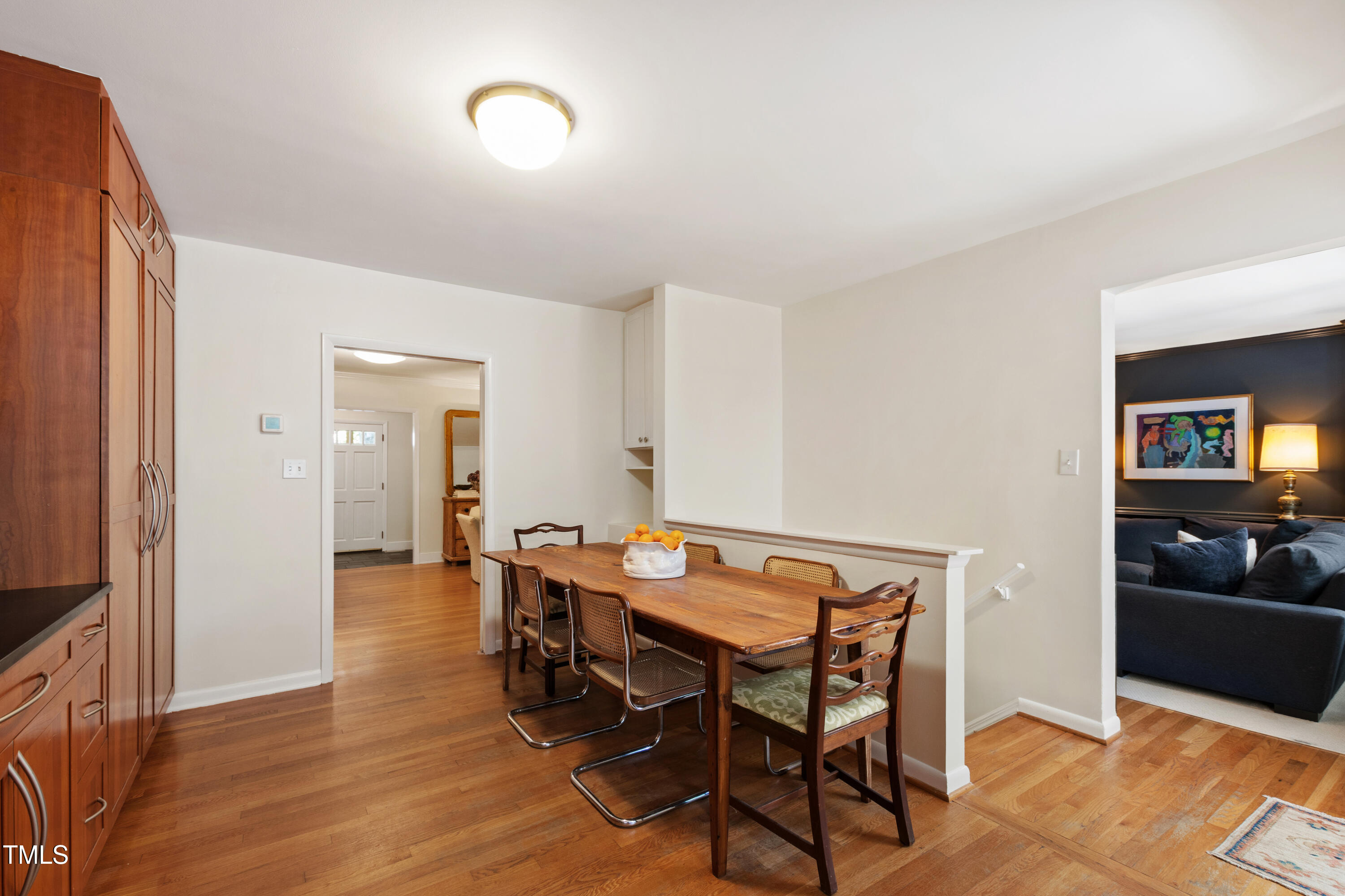 3028 Rothgeb Drive Raleigh, NC 27609 - Photo 15 of 35 a view of a dining room with furniture and wooden floor