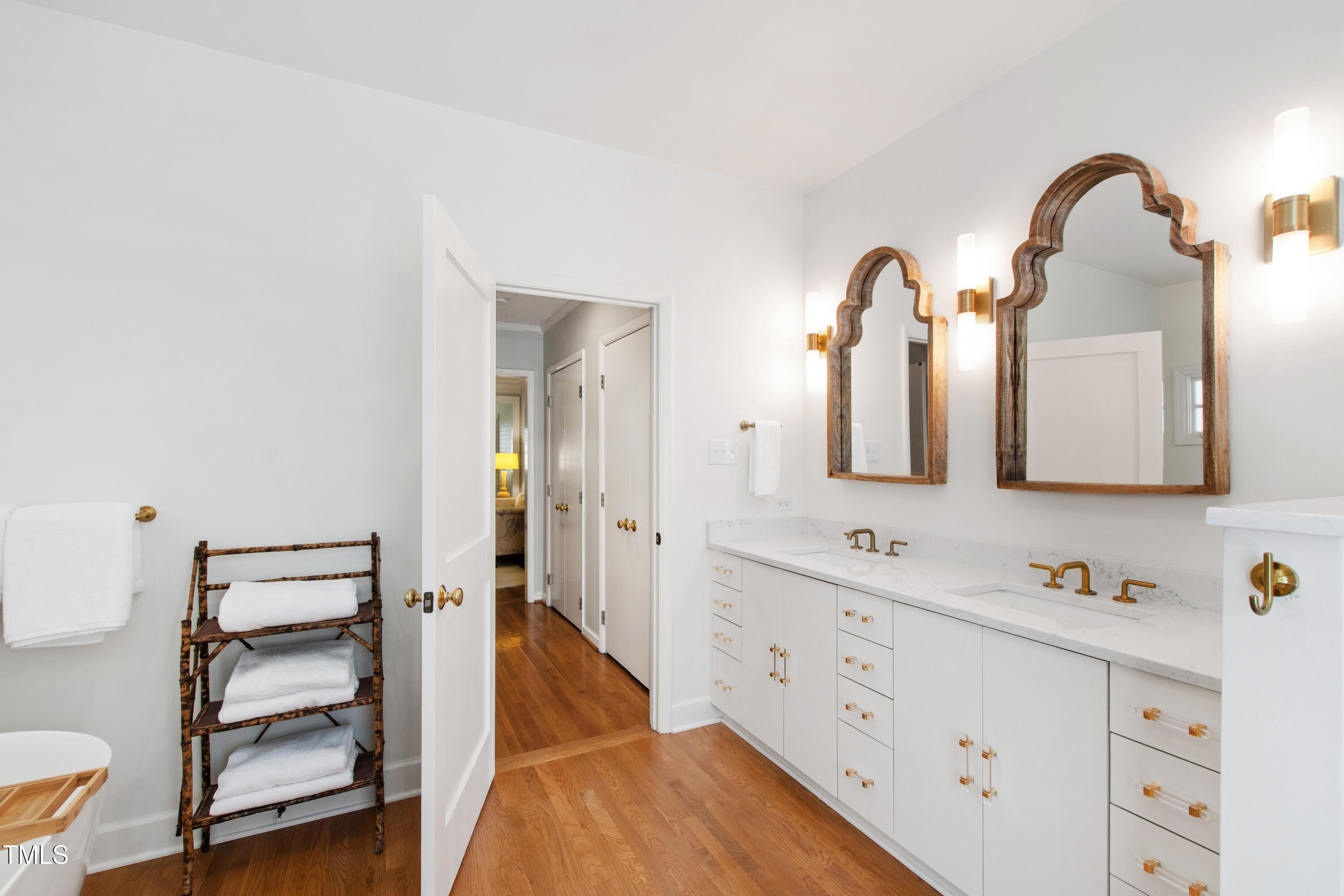 3028 Rothgeb Drive Raleigh, NC 27609 - Photo 20 of 35 a spacious bathroom with a double vanity sink and a mirror