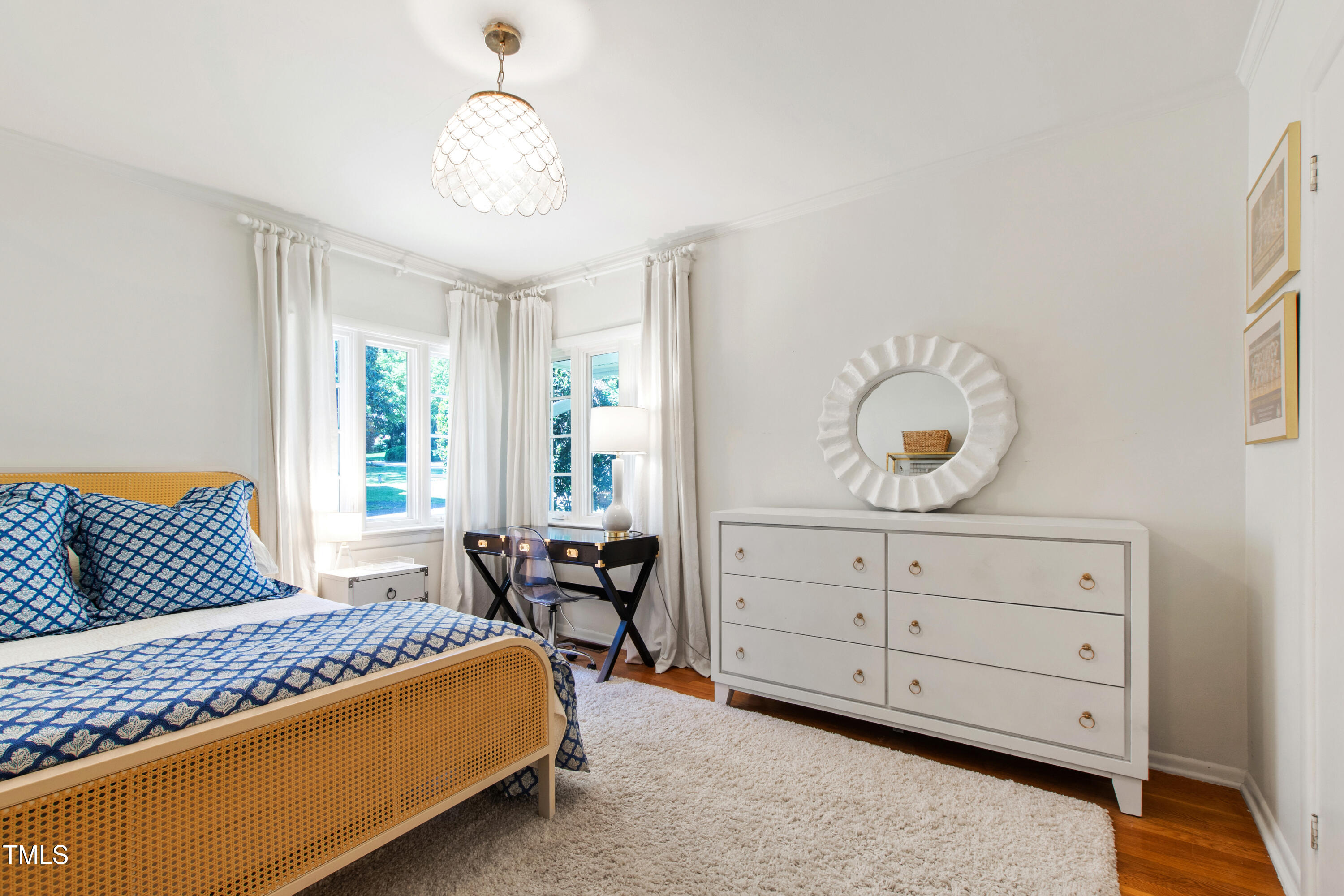 3028 Rothgeb Drive Raleigh, NC 27609 - Photo 23 of 35 a bedroom with a bed and window