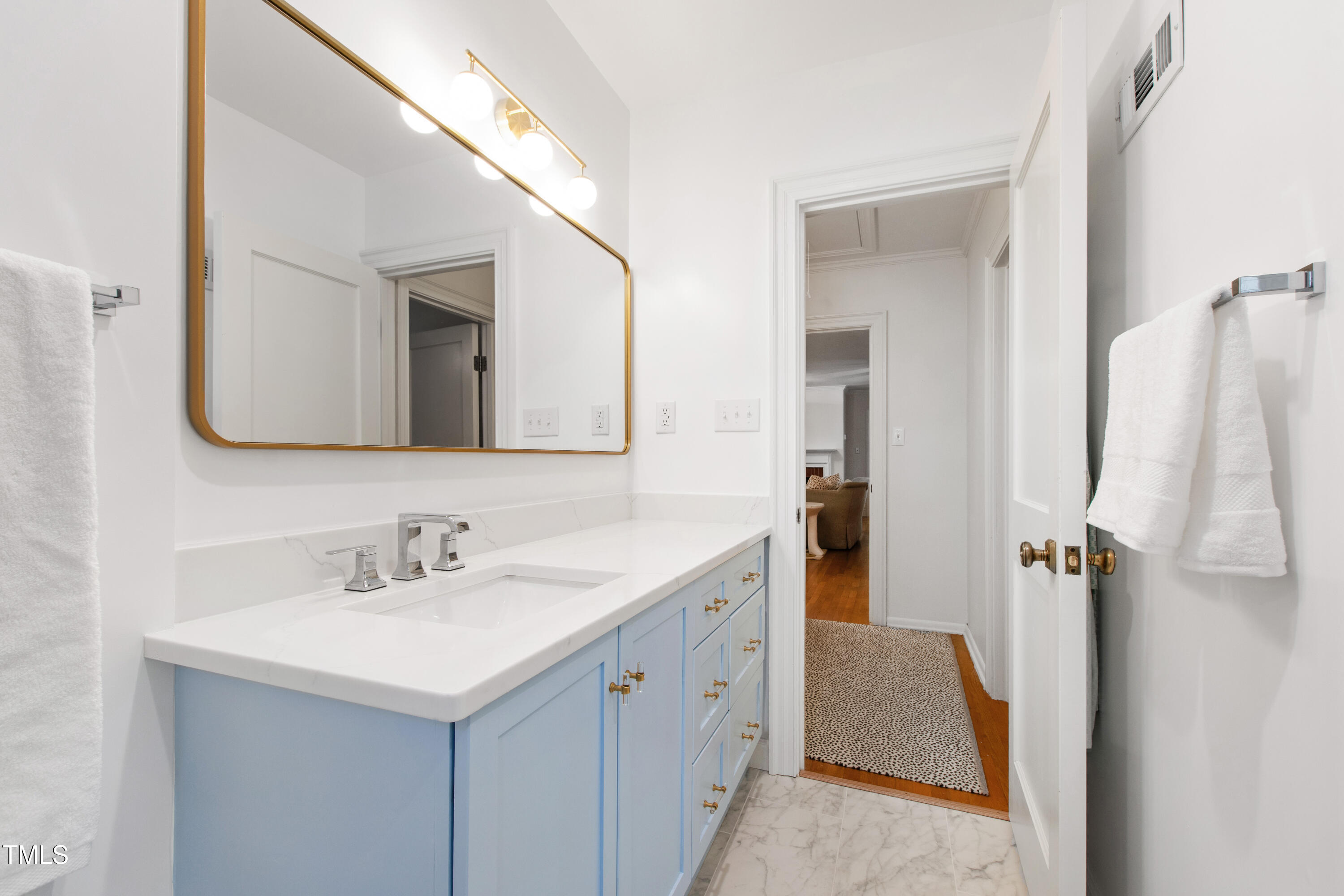 3028 Rothgeb Drive Raleigh, NC 27609 - Photo 24 of 35 a bathroom with a double vanity sink and mirror