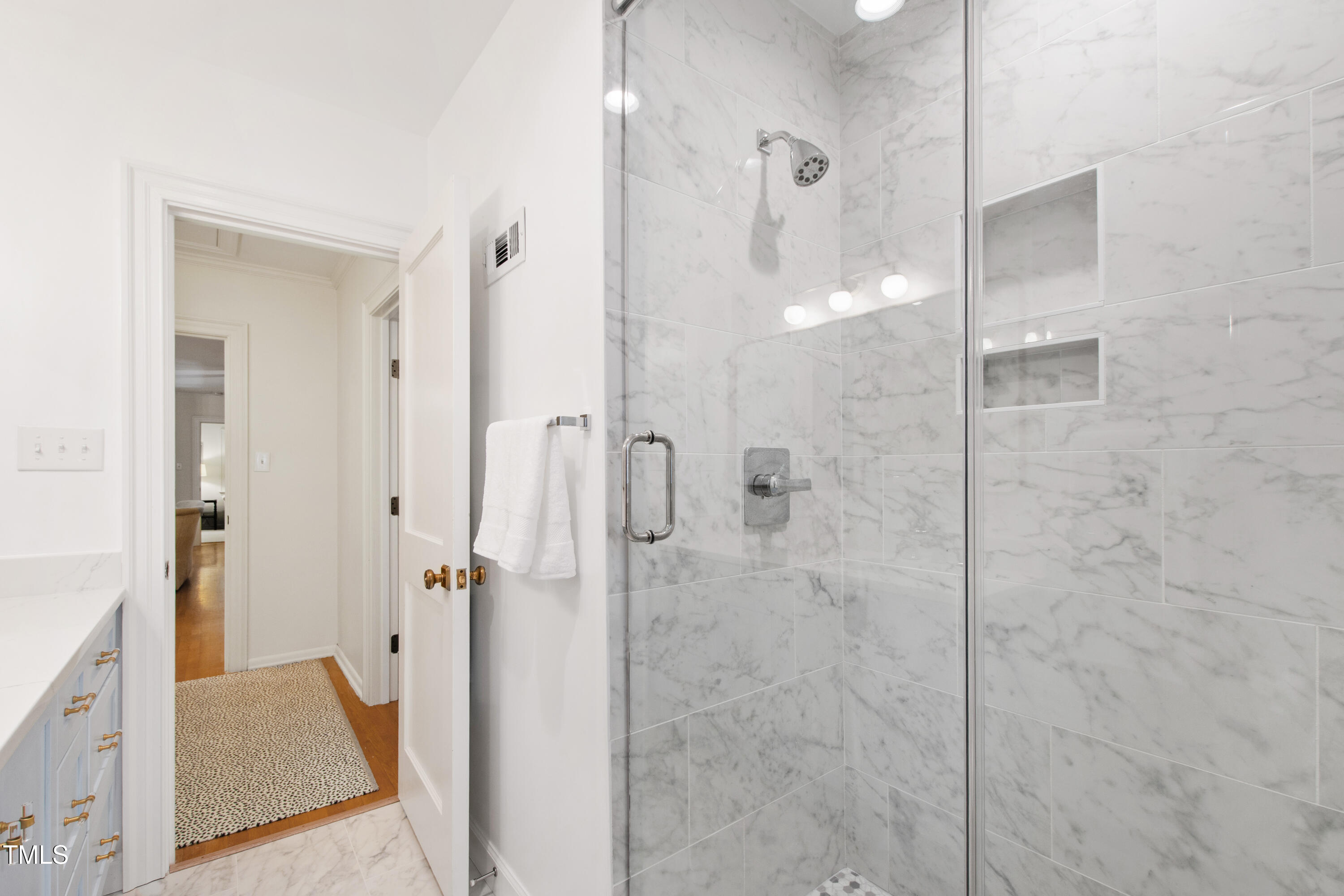 3028 Rothgeb Drive Raleigh, NC 27609 - Photo 25 of 35 a bathroom with a shower and a sink