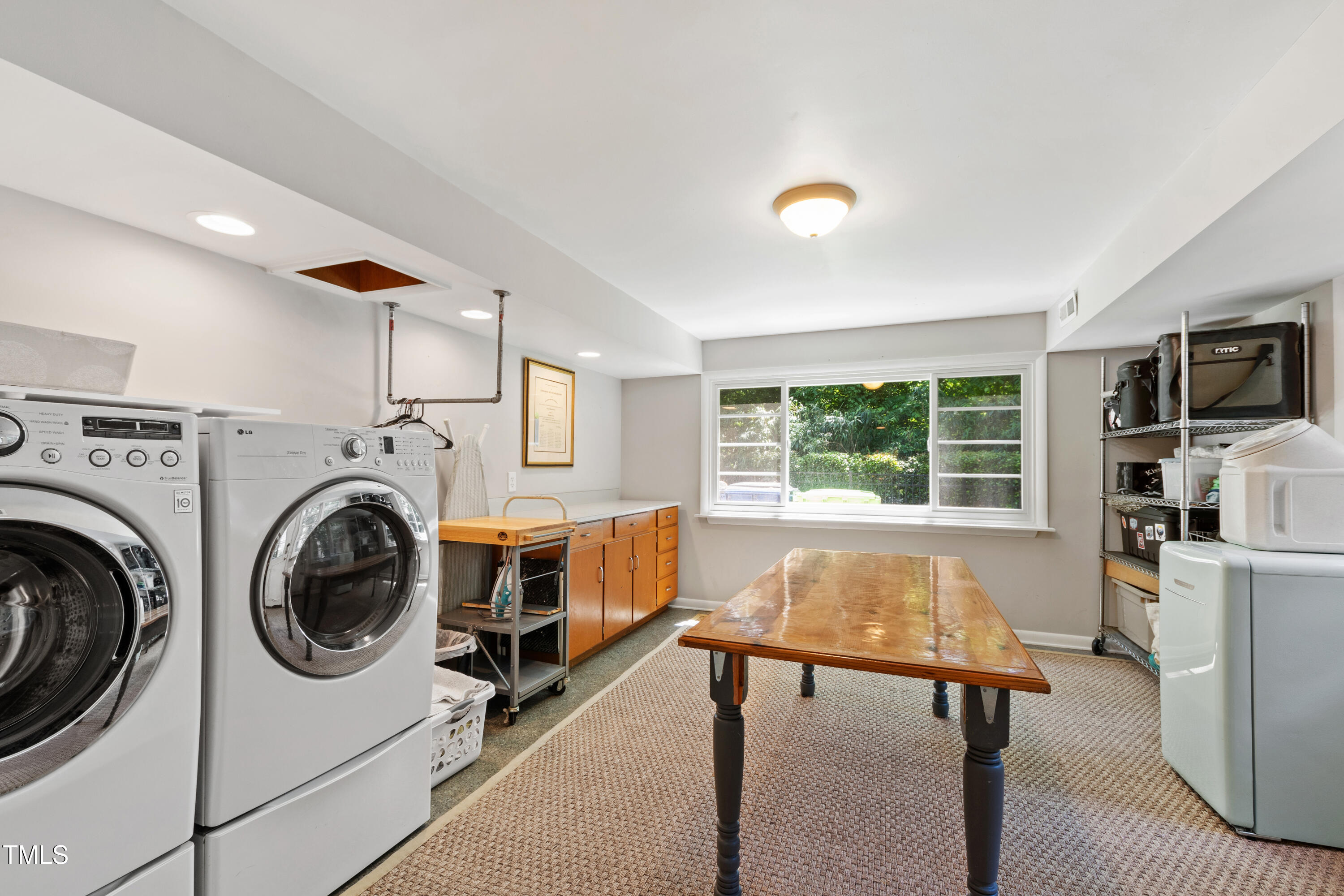 3028 Rothgeb Drive Raleigh, NC 27609 - Photo 28 of 35 a view of livingroom with washer and dryer