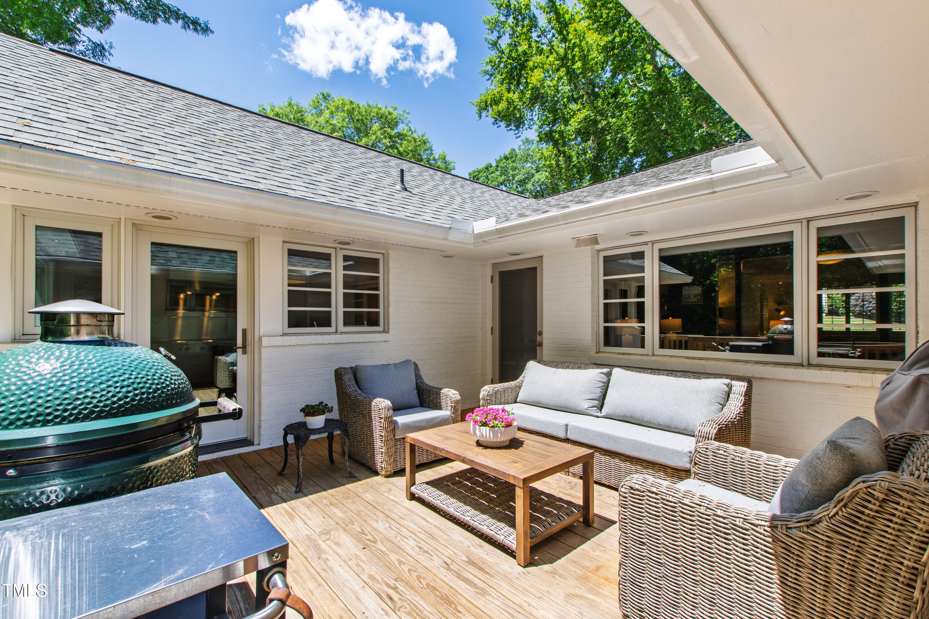 3028 Rothgeb Drive Raleigh, NC 27609 - Photo 32 of 35 a outdoor living space with furniture potted plant and a large window