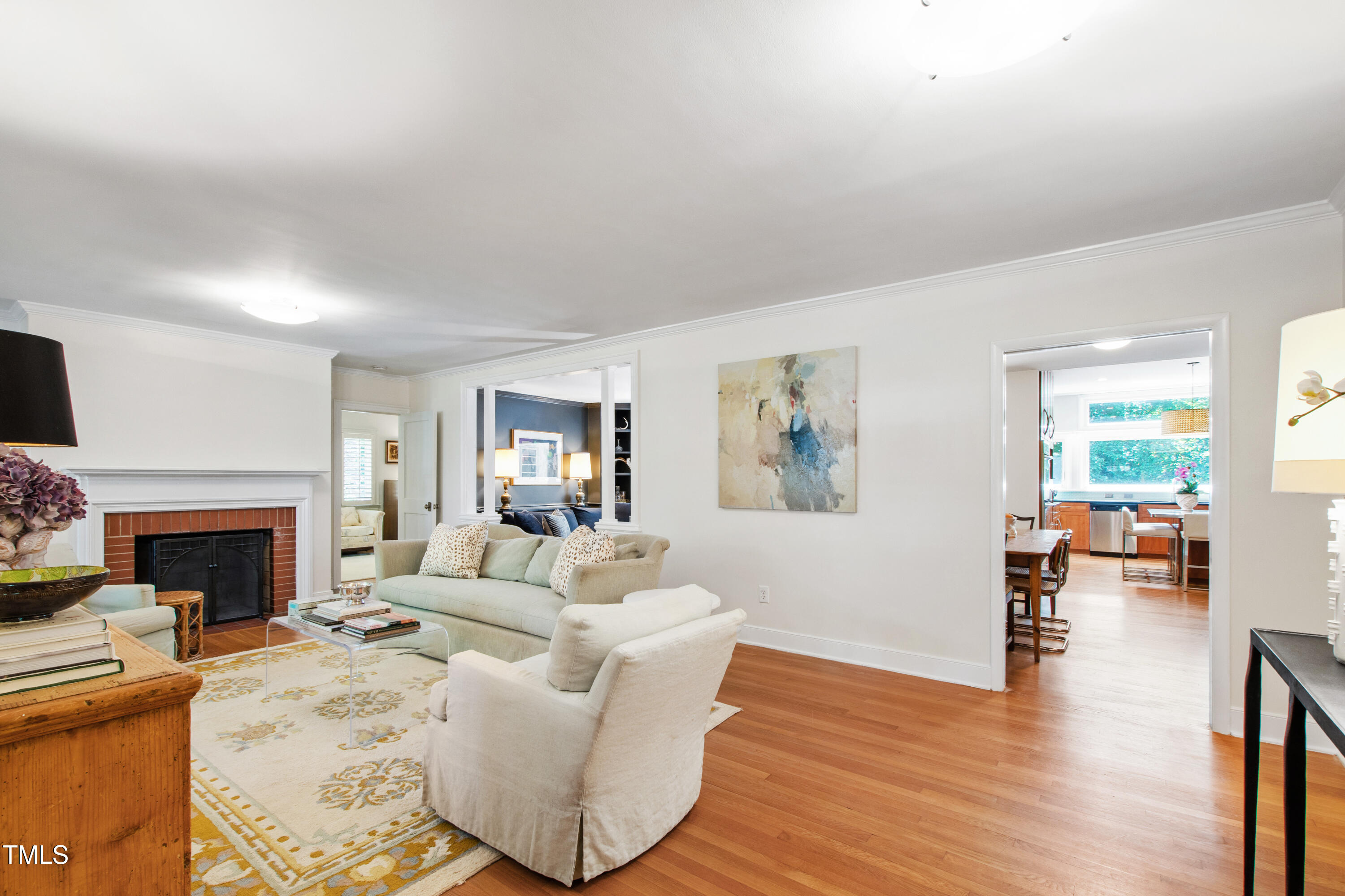 3028 Rothgeb Drive Raleigh, NC 27609 - Photo 6 of 35 a living room with furniture and a fireplace