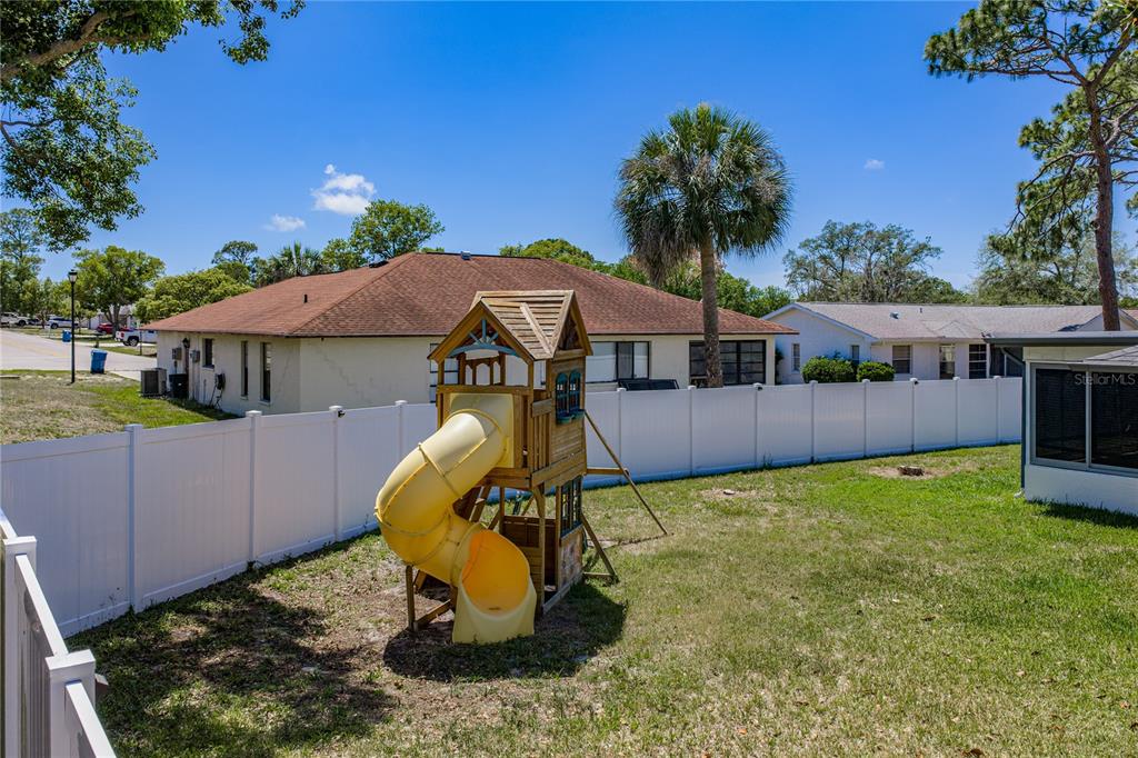 7435 Kilbride Court Weeki Wachee, FL 34613 - Photo 58 of 67 a view of a house with backyard and sitting area