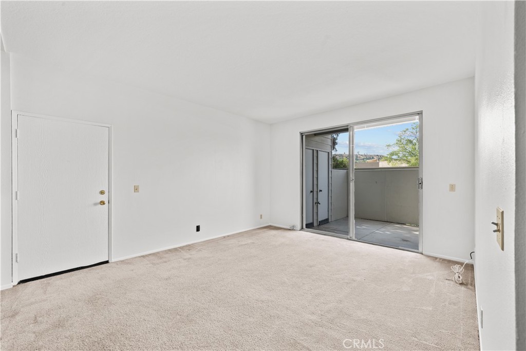 27645 Susan Beth Way, Unit A Saugus, CA 91350 - Photo 3 of 26 a view of an empty room with windows
