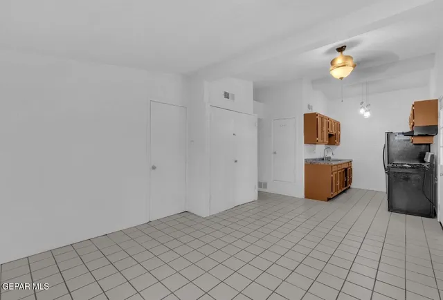 a view of a storage & utility room with two washing machine