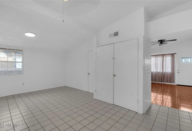 a view of an empty room and window