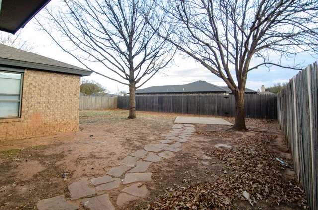 a backyard of a house with lots of green space