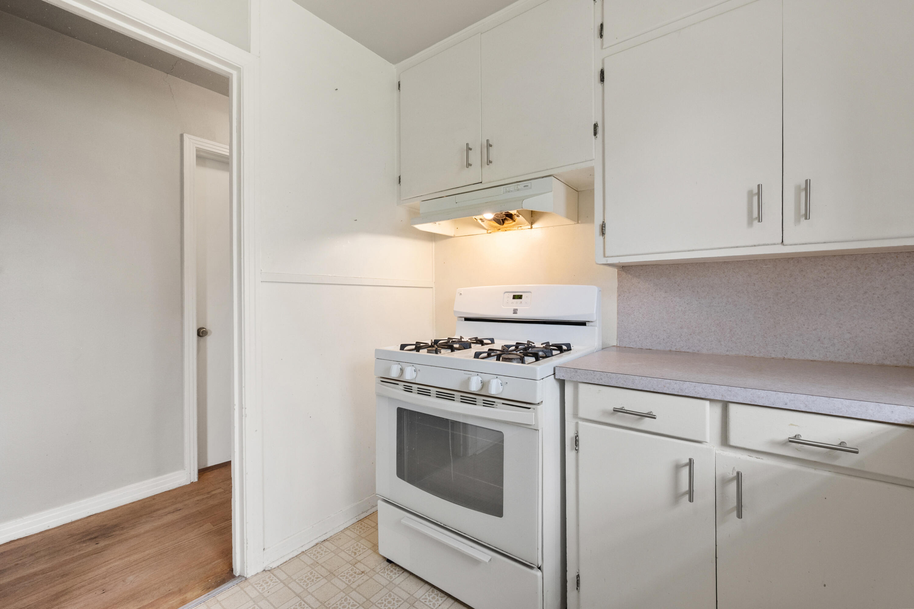 811 Zephyr Plainview, TX 79072 - Photo 12 of 25 a kitchen with cabinets and appliances