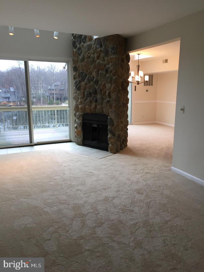11242 Harbor Court, Unit 1242 Reston, VA 20191 - Photo 6 of 8 a view of empty room with a fireplace