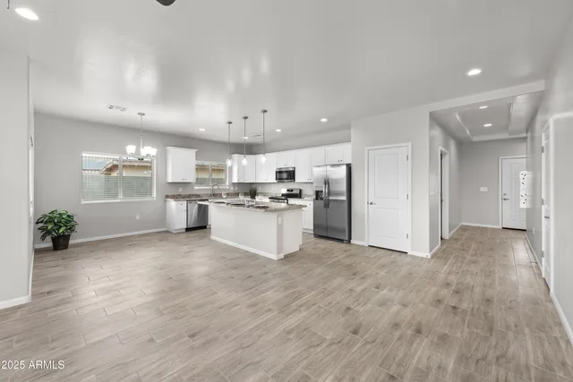 a view of kitchen with wooden floor