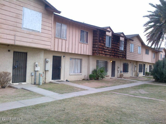3605 West Bethany Home Road, Unit 8 Phoenix, AZ 85019 - Photo 1 of 10 a front view of a building with a garden