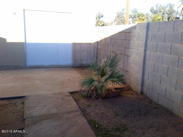 3605 West Bethany Home Road, Unit 8 Phoenix, AZ 85019 - Photo 10 of 10 a backyard view of a house