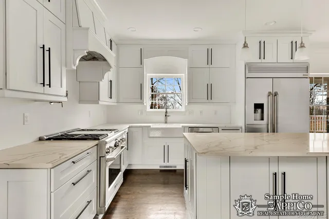 a kitchen with granite countertop a sink stove and cabinets