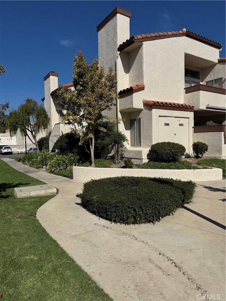 1730 Sinaloa Road Simi Valley, CA 93065 - Photo 1 of 38 a front view of a house with a yard