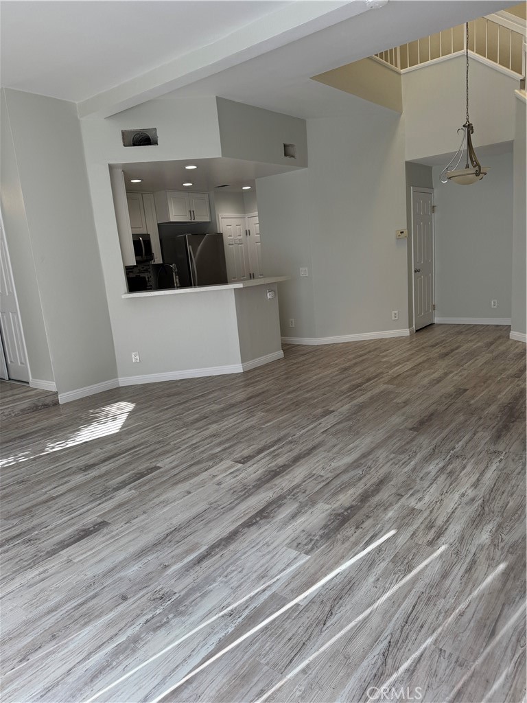 1730 Sinaloa Road Simi Valley, CA 93065 - Photo 16 of 38 a view of a hallway with wooden floor