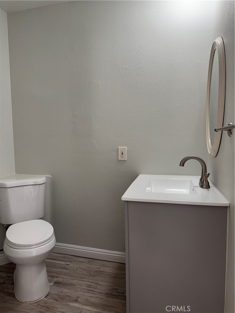 1730 Sinaloa Road Simi Valley, CA 93065 - Photo 18 of 38 a bathroom with a toilet sink and mirror