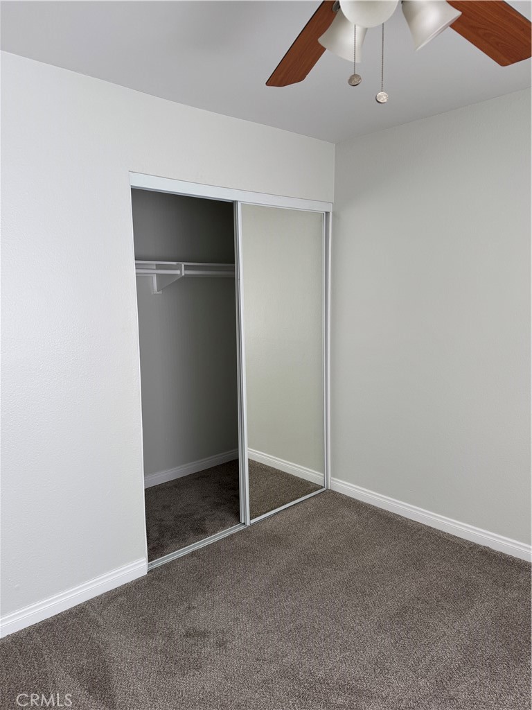1730 Sinaloa Road Simi Valley, CA 93065 - Photo 24 of 38 an empty room with closet and a chandelier fan