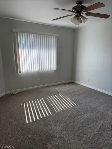 a view of a livingroom with a ceiling fan