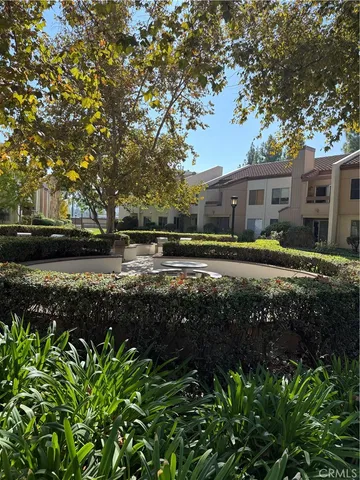 a view of a swimming pool with a yard