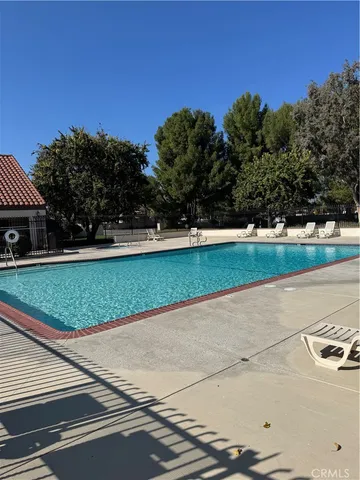 a view of a house with a wooden deck