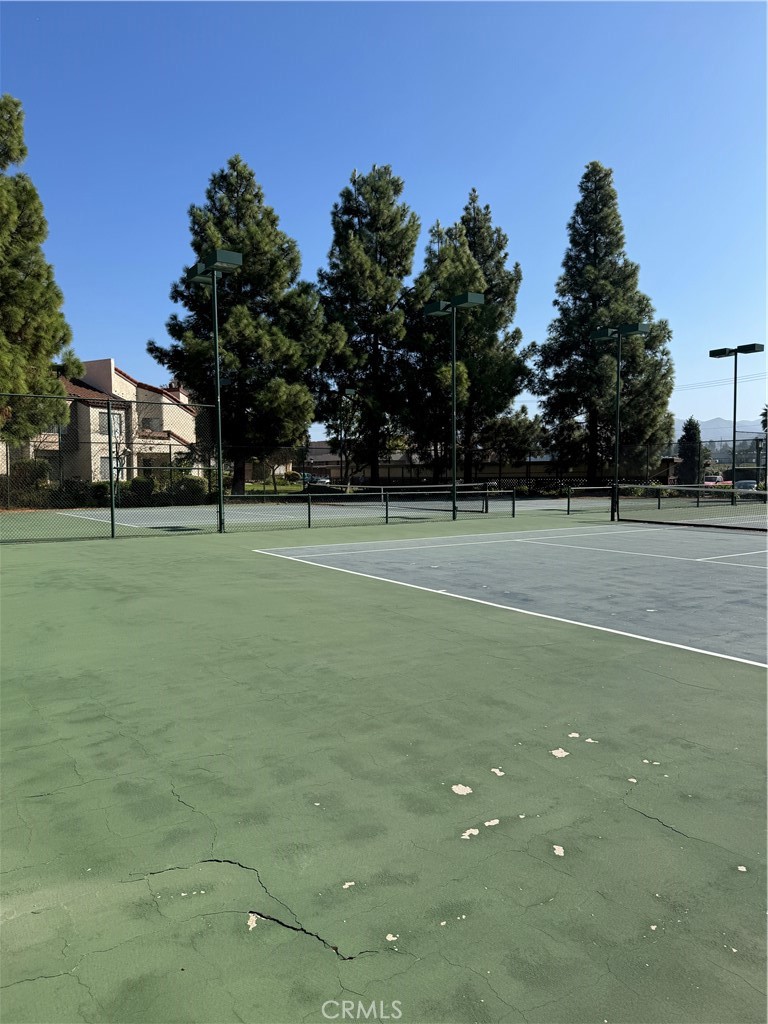 1730 Sinaloa Road Simi Valley, CA 93065 - Photo 35 of 38 a view of a tennis ground with large trees